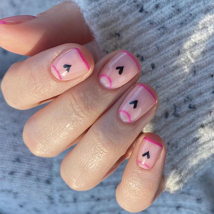 Creative Nail Art with Heart Design and Glitter Accents Stornfield