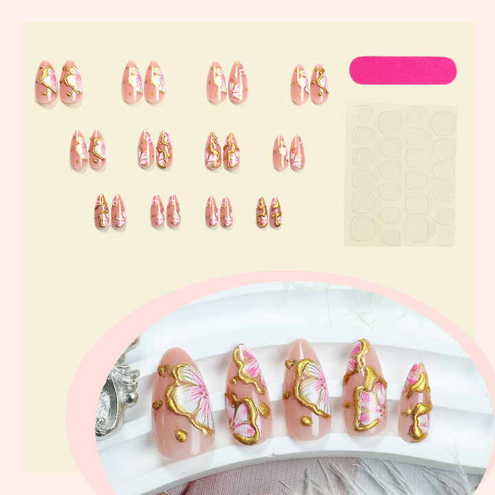 Artificial nails with graceful floral patterns and golden accents Stornfield