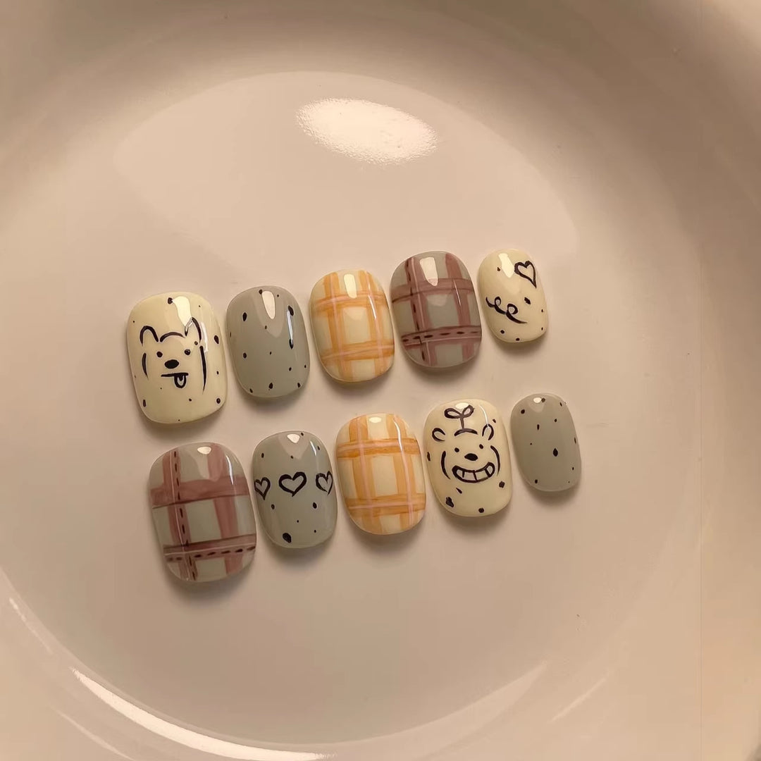 Playful Cartoon-Character Press-On Nail Art Collection