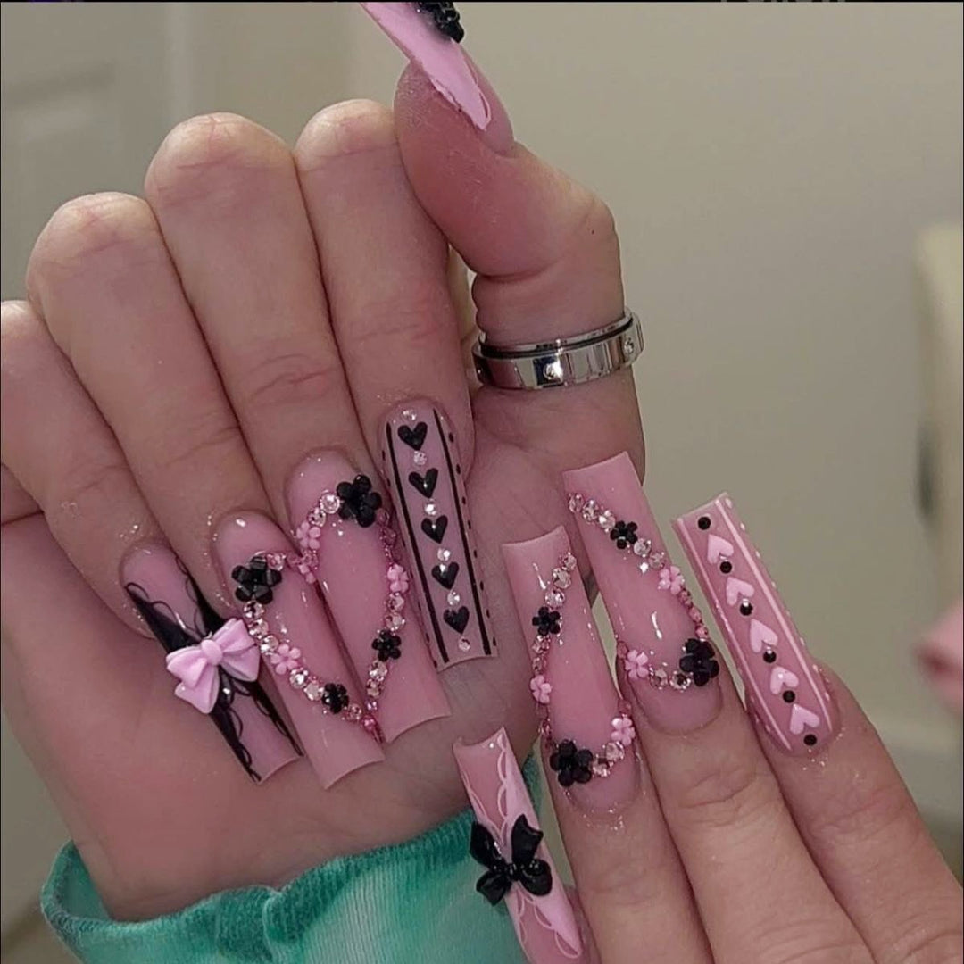 Fake nail set with playful 3D roses and elegant accents Stornfield