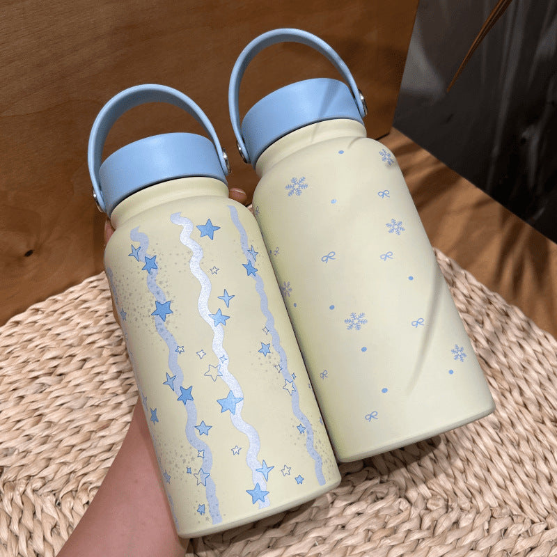 Women's insulated drinking bottle with practical carrying handle and cheerful design Stornfield