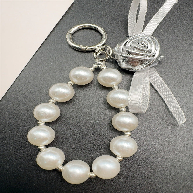 Elegant Pearl and Leather Charm Keychain Stornfield