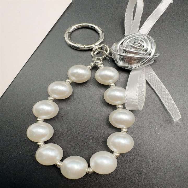 Elegant Pearl and Leather Charm Keychain Stornfield
