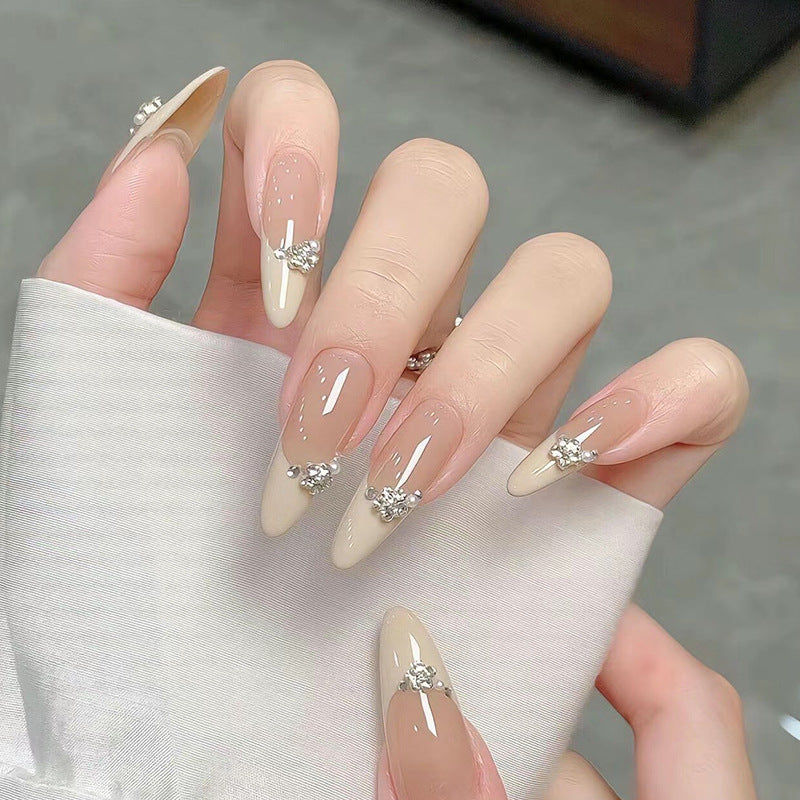 Acrylic nail set with elegant tips and sparkling appliqués Stornfield