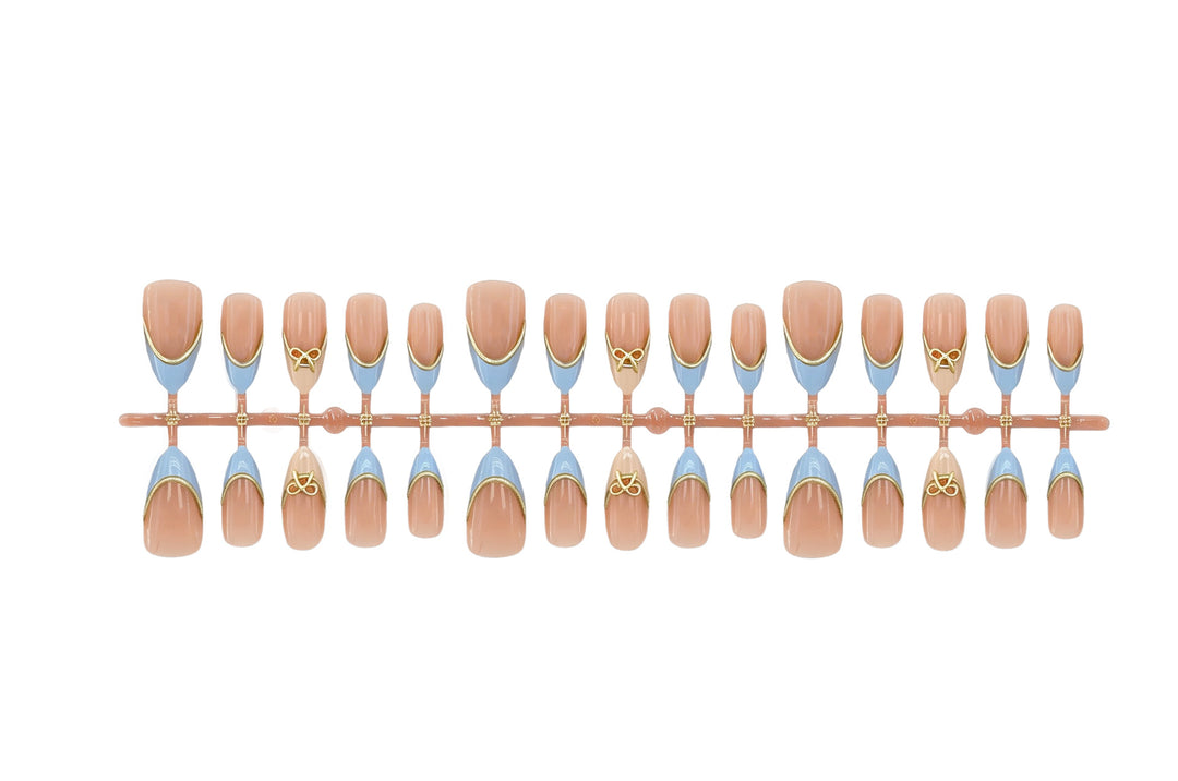 Acrylic nail set with elegant designs and gold accents Stornfield