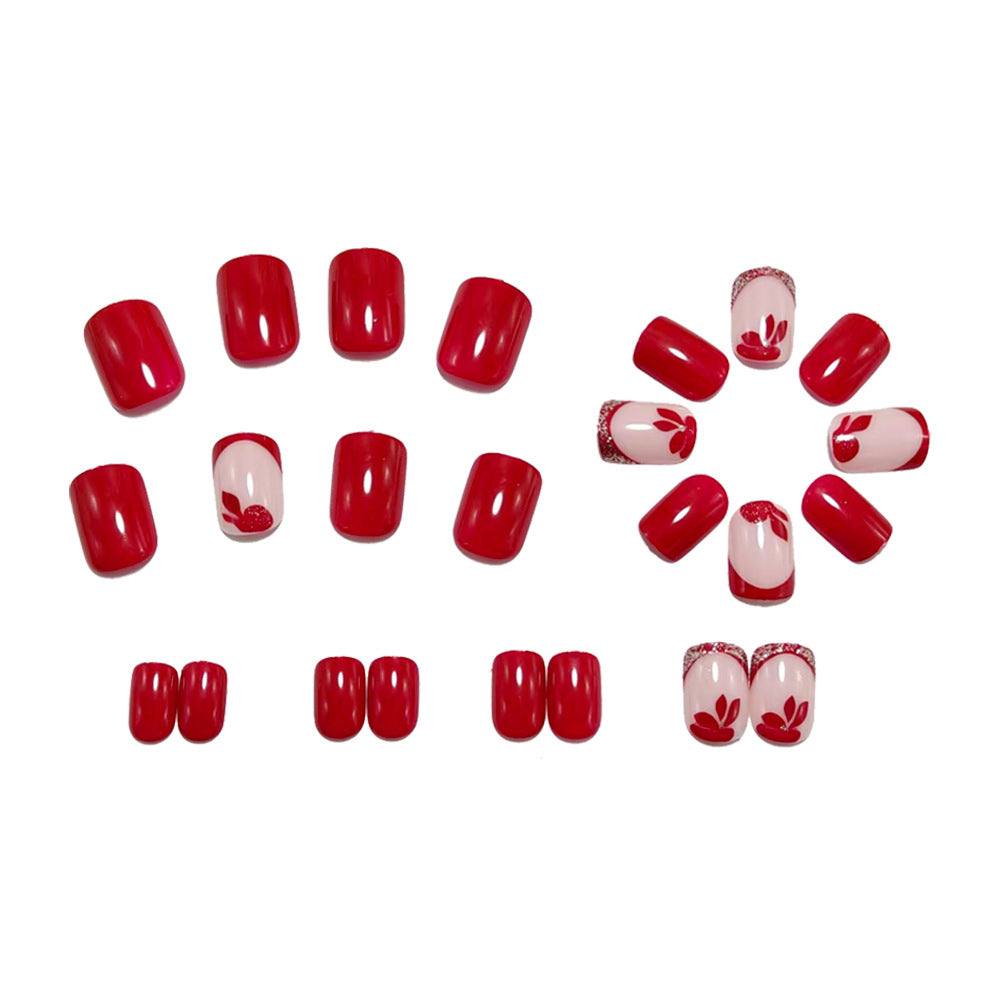 Artificial nails with floral design and elegant glitter details Stornfield