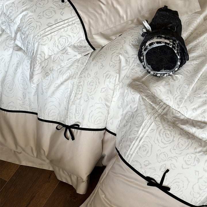 Reversible Duvet Cover Bedding Set with Quilted Jacquard Panel, Black Piped Trim & Decorative Bow Shams