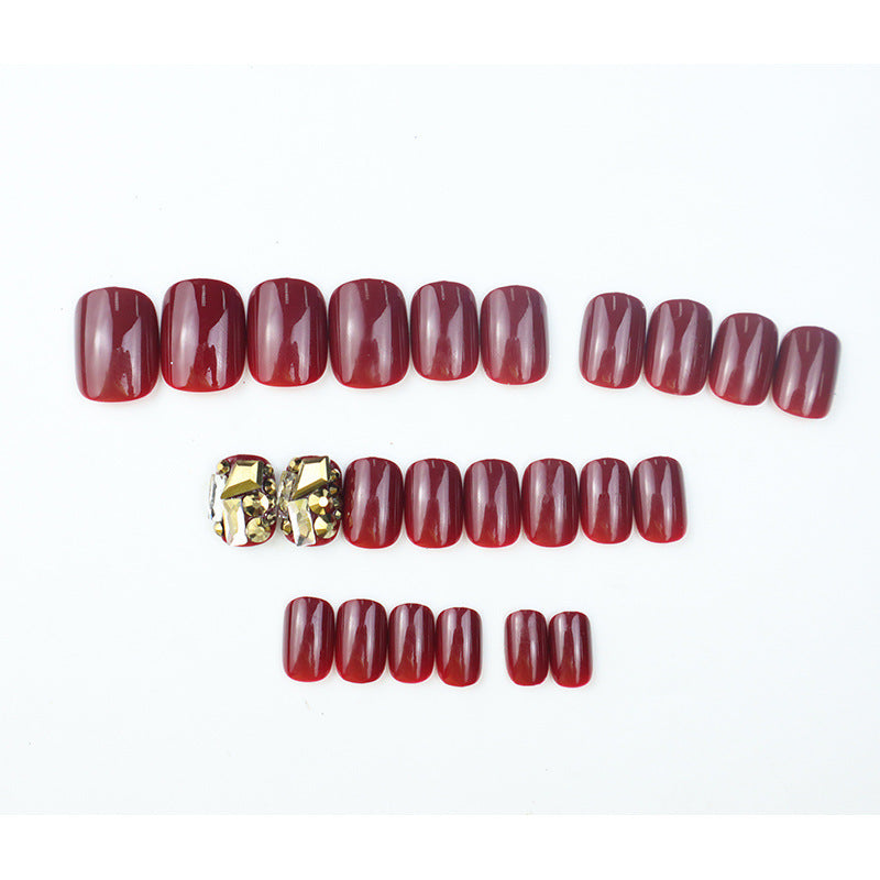 Glossy Press-On Nail Set with Decorative Gem Accents Stornfield