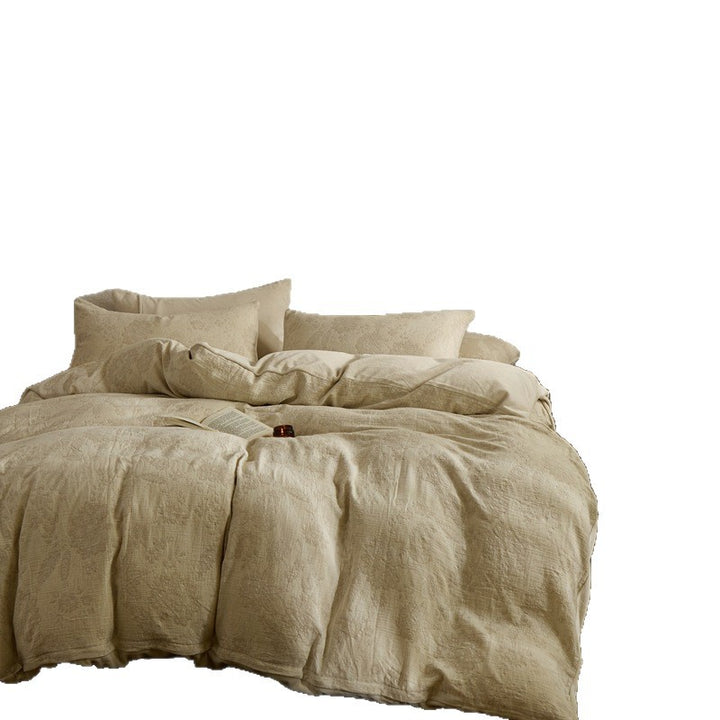 Quilted reversible bed with floral muslin surface and plush fleece back