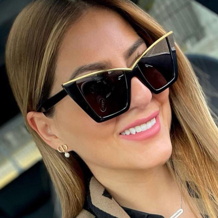Women extravagant sunglasses with unique design and golden accents Stornfield