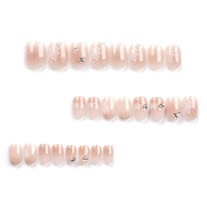 Elegant Nail Art with Holographic Accents and Floral Embellishments Stornfield
