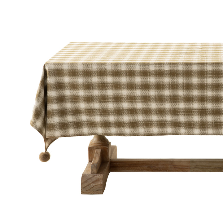 Rectangular checked tablecloth made of cotton blend with pom-pom corners