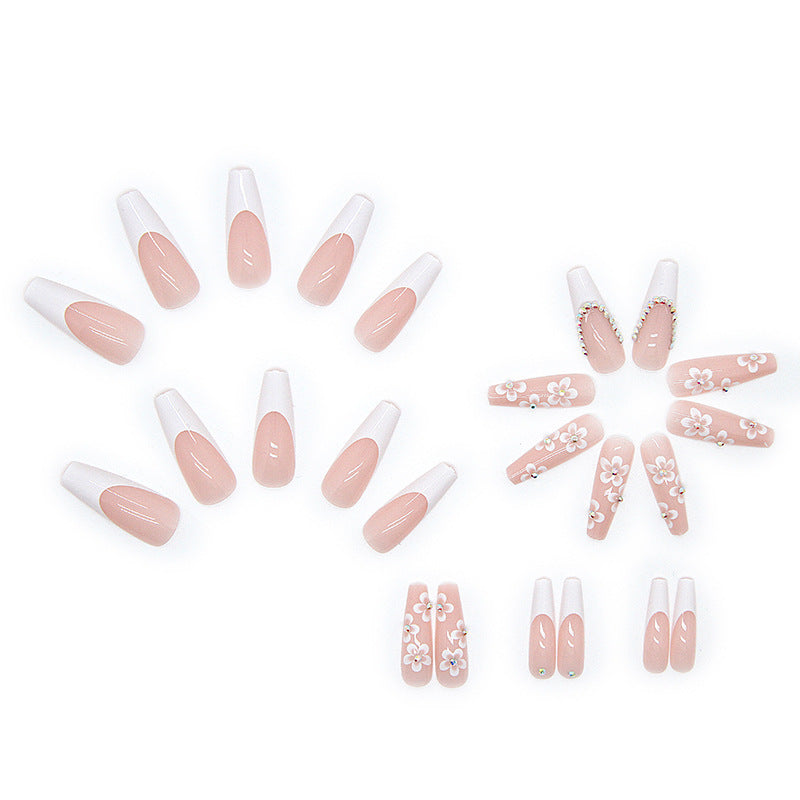 Artificial nail set with romantic floral decorations and glitter accents Stornfield