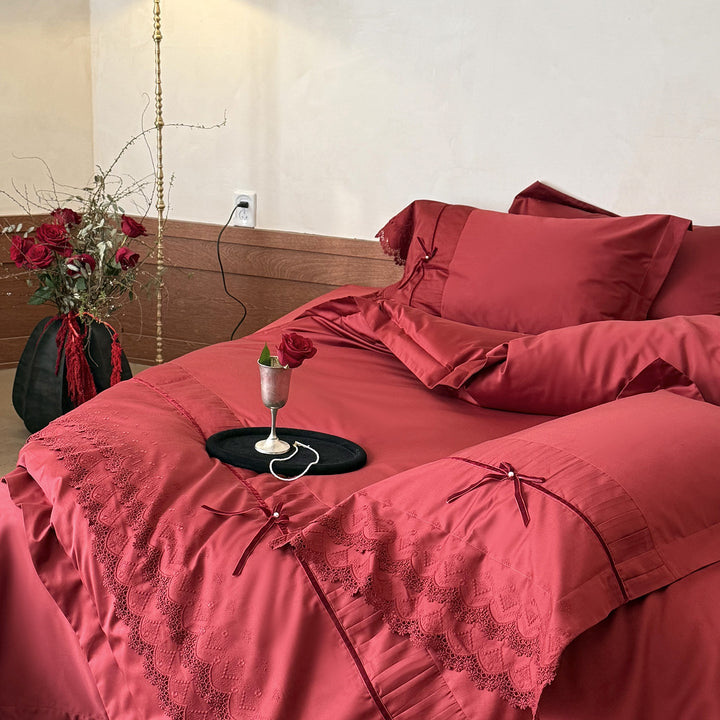 Romantic satin bedding set with lace trim, pleated detail and satin bows