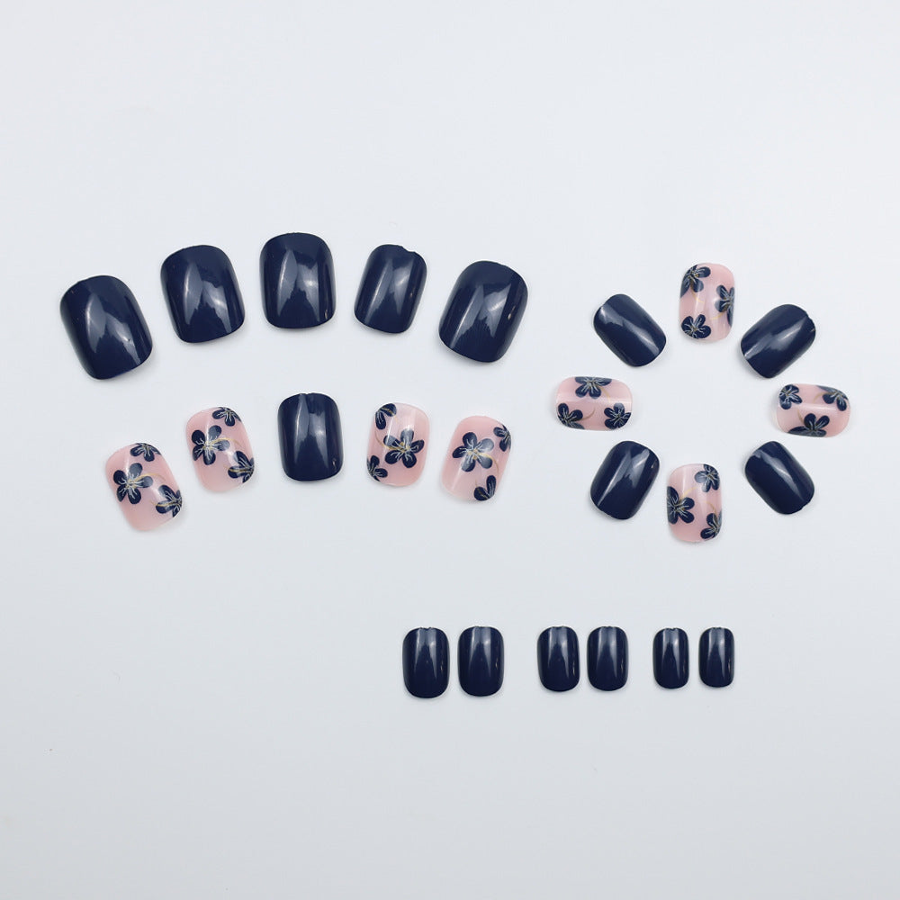 Artificial nails with floral designs and glossy accents Stornfield