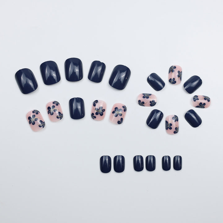 Artificial nails with floral designs and glossy accents Stornfield
