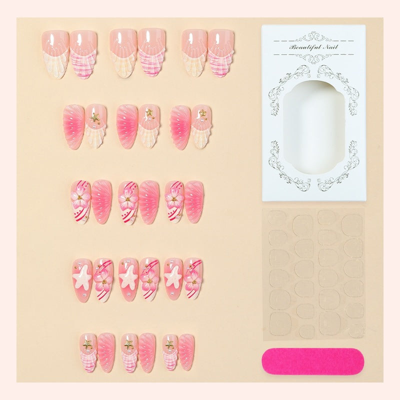 Artificial nail set with maritime shell and flower design Stornfield