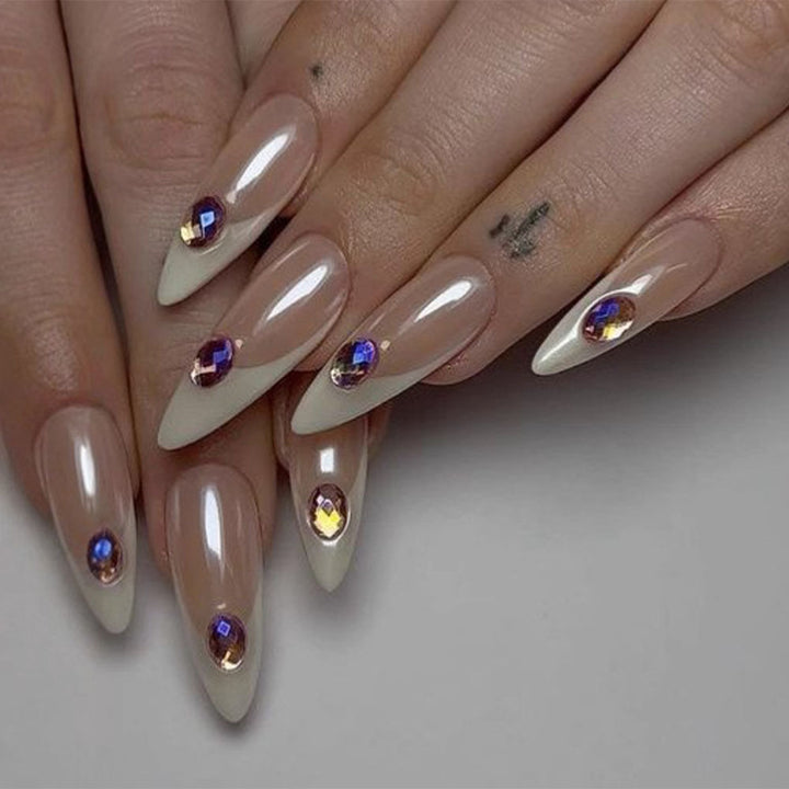 Artificial nails in modern stiletto design with glitter accents Stornfield