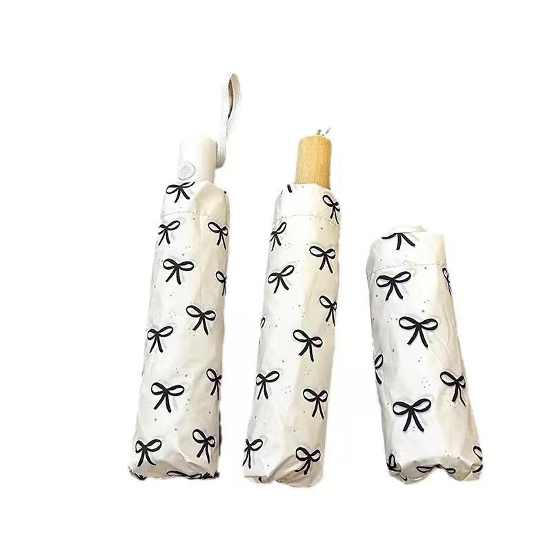 Women's foldable umbrella with elegant bow design Stornfield