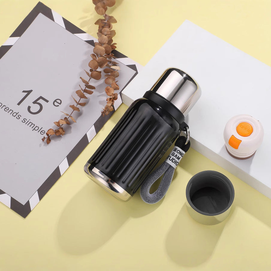 Unisex double-walled insulated bottle with one-handed safety lock and removable drinking cup Stornfield