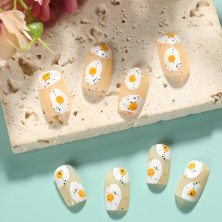 Artificial nails in creative fried egg design Stornfield