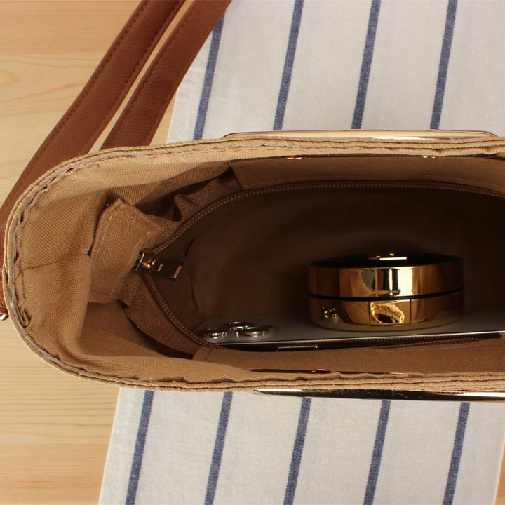 Shoulder bag made of handwoven natural material with elegant handle Stornfield
