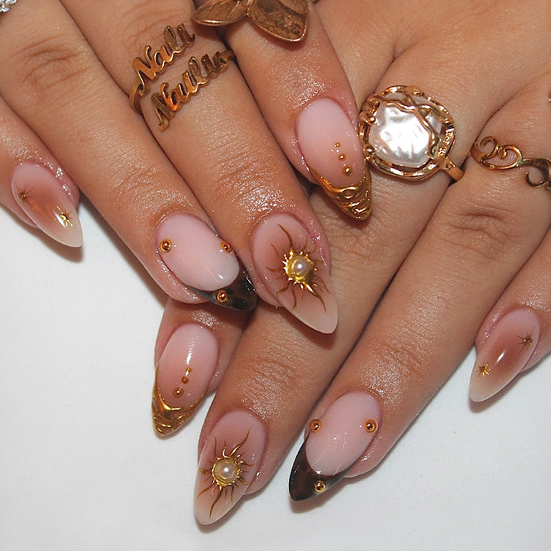 Artificial nail set with elegant gold pearls and delicate designs Stornfield