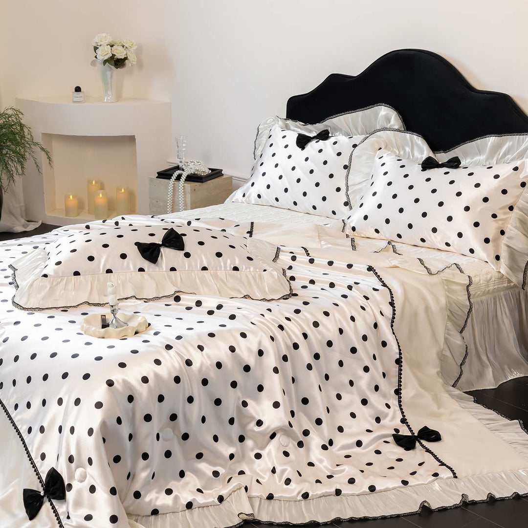 Romantic polka dot satin bedding set with ruffles and decorative ribbons