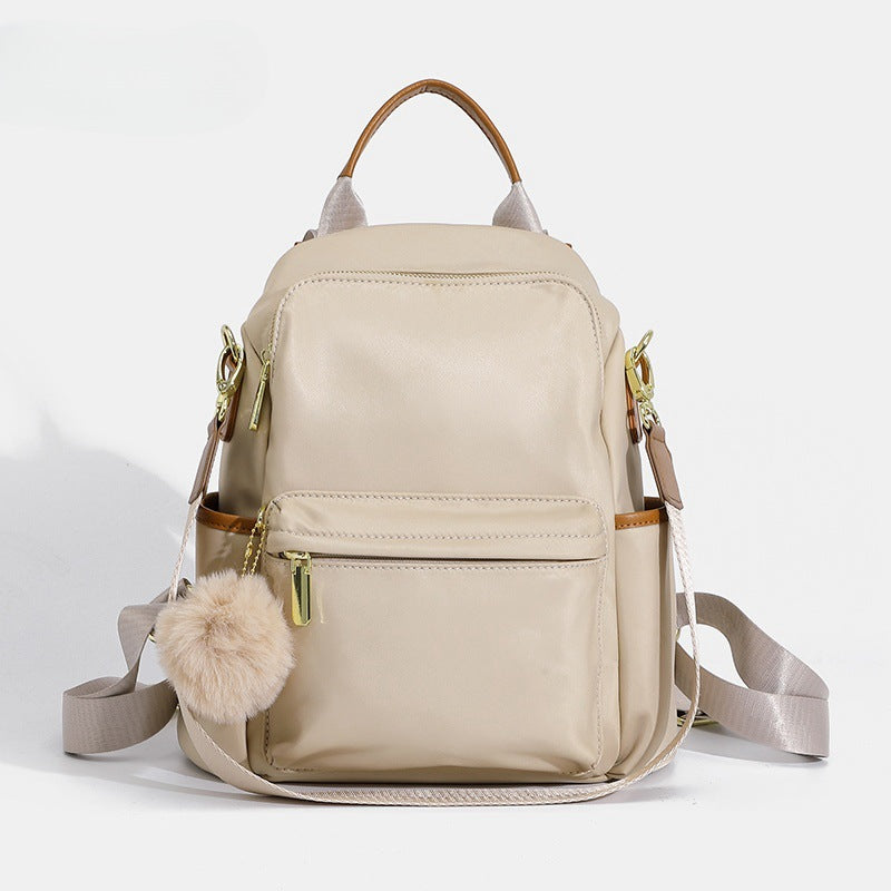 Versatile Multi-Pocket Backpack with Stylish Pom-Pom