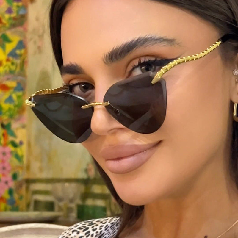 Women's Cat-Eye Sunglasses with unique gold frame design and protective lenses Stornfield