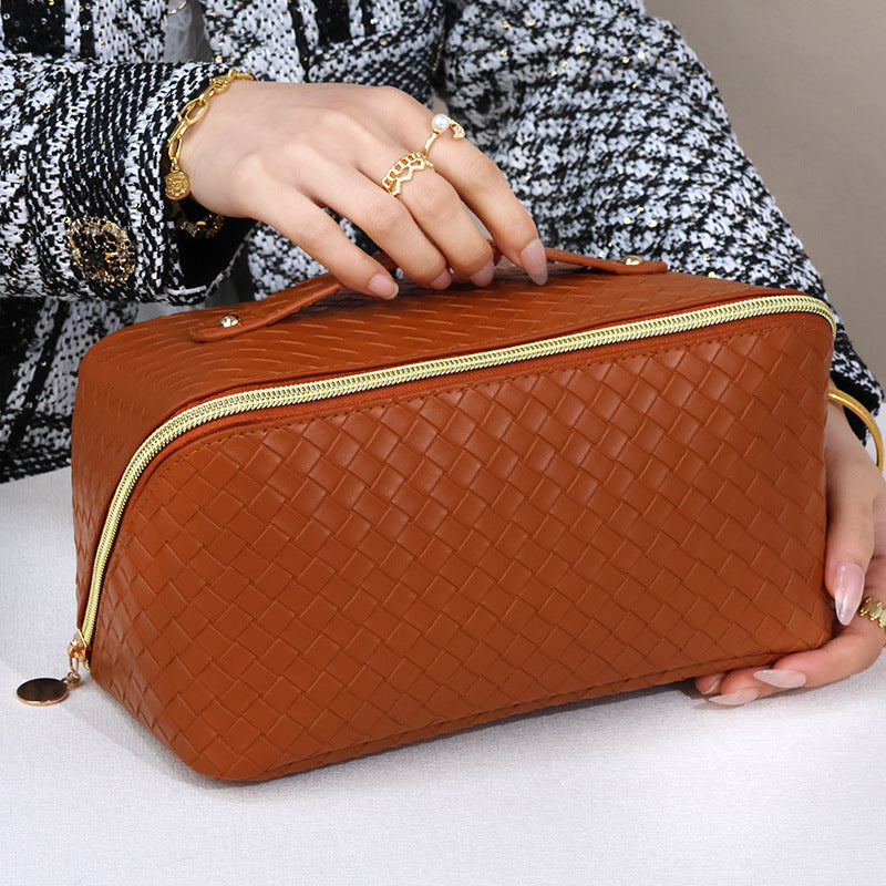 Cosmetic transport bag made of high-quality braided synthetic leather with practical zipper and carrying handle Stornfield