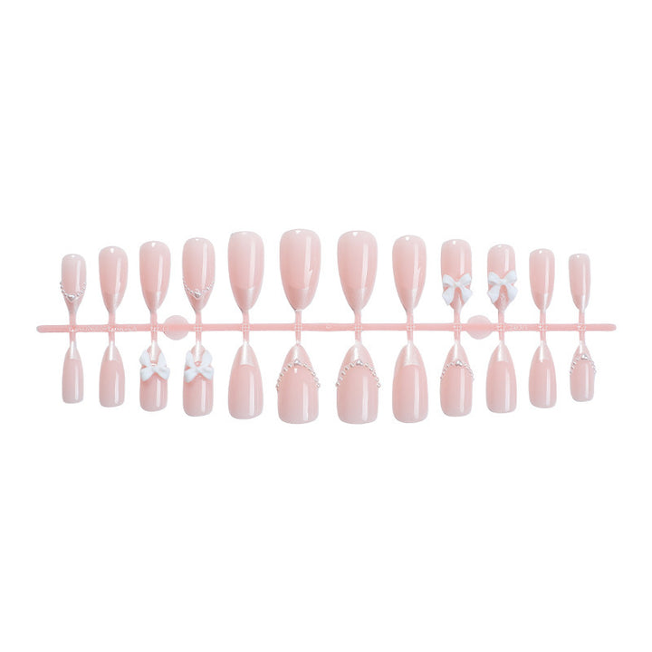Artificial nail set with elegant bows and pearls Stornfield