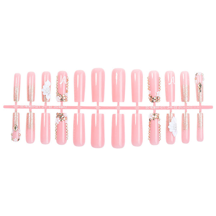 Creative acrylic nail set with delicate flower and gloss embellishments Stornfield