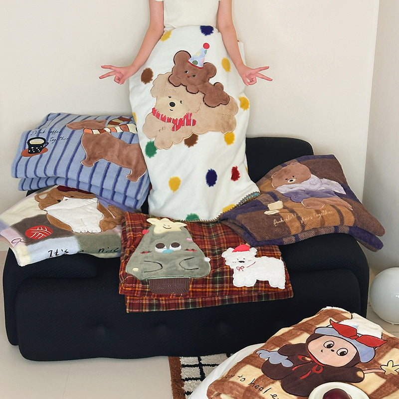 Plaid blanket checkered with appliqued animal motifs and soft velour lining