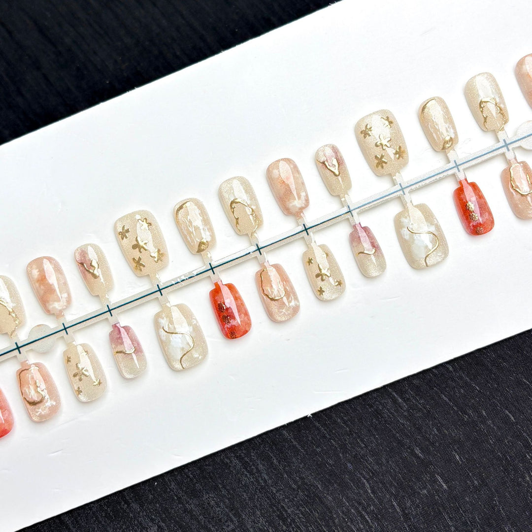 Artistic Glittery Press-On Nail Art Set with Gold Accents