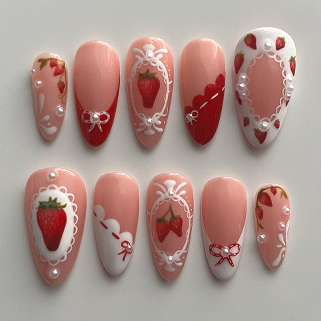 Artful nail extensions with strawberry motifs Stornfield