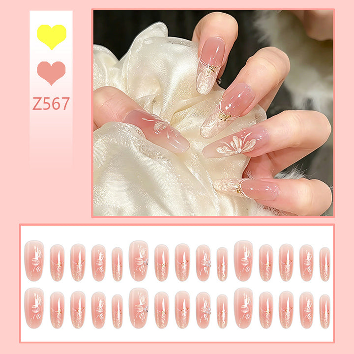 Acrylic nail set with filigree flower and glitter elements Stornfield