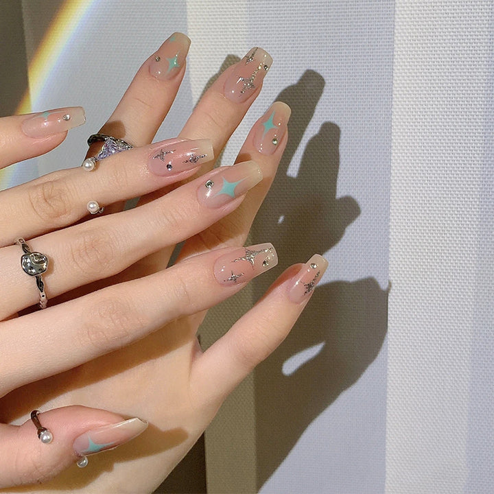 Acrylic nail set with sparkling star and glitter elements Stornfield