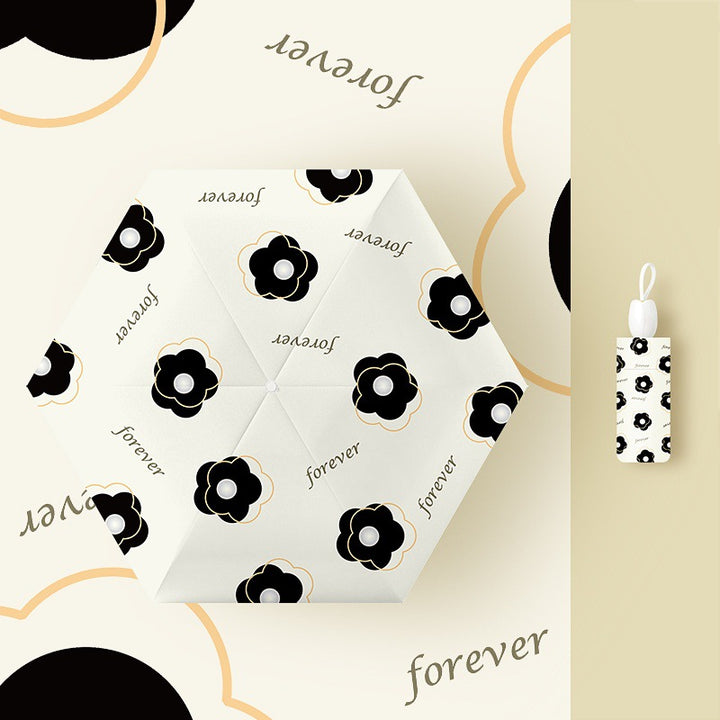 Ladies folding umbrella with playful flower design Stornfield