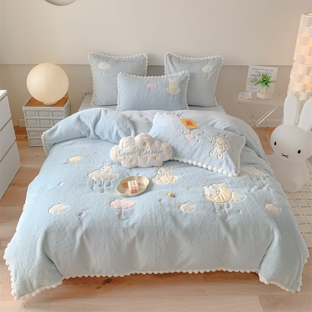 Cozy velvet bedding set for children with embroidered cloud motifs and pompom border