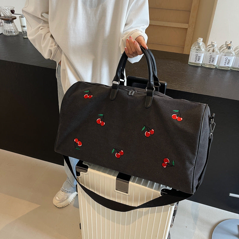Sporty weekend bag with playful cherry pattern Stornfield