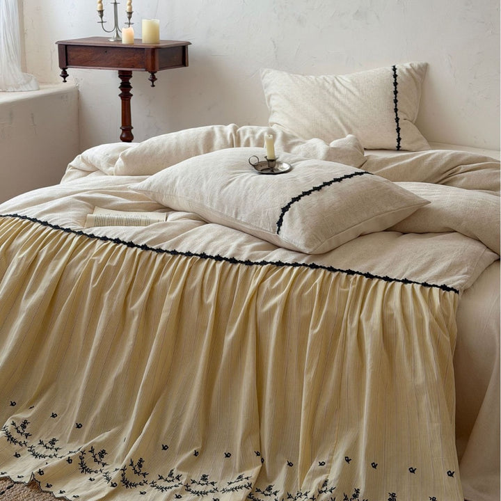 Bedding set with gathered bed skirt, embroidered trim and cotton-linen mix