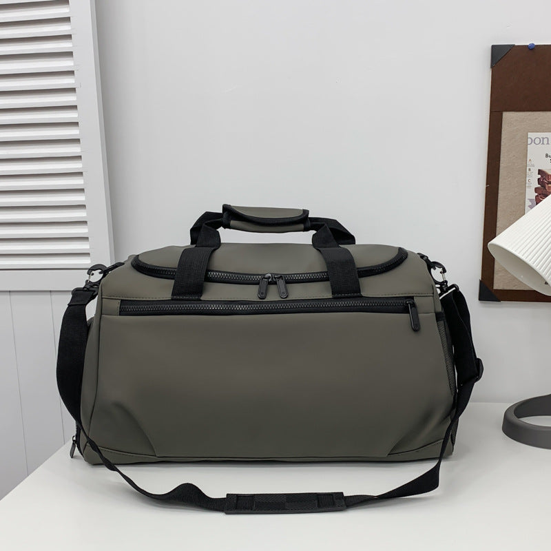 Sporty travel bag with reinforced carrying handles and multiple compartments Stornfield