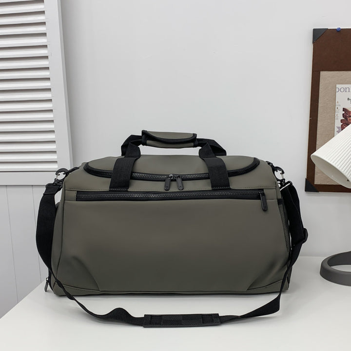Sporty travel bag with reinforced carrying handles and multiple compartments Stornfield