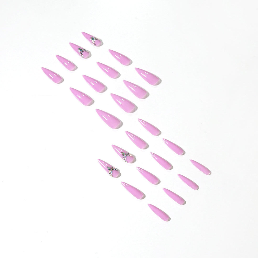 Glamorous stiletto nails with rhinestone decoration Stornfield