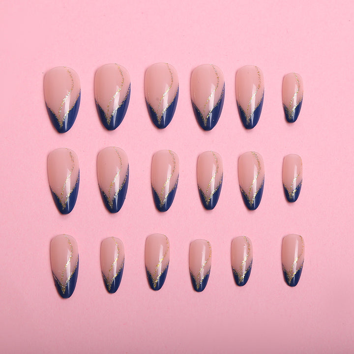 Artistic Nail Design with Elegant Golden Accents Stornfield