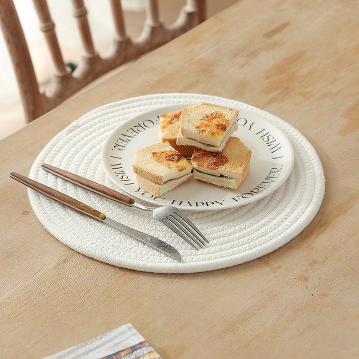 Braided round table mat made of cotton rope and sea grass with spiral structure Stornfield