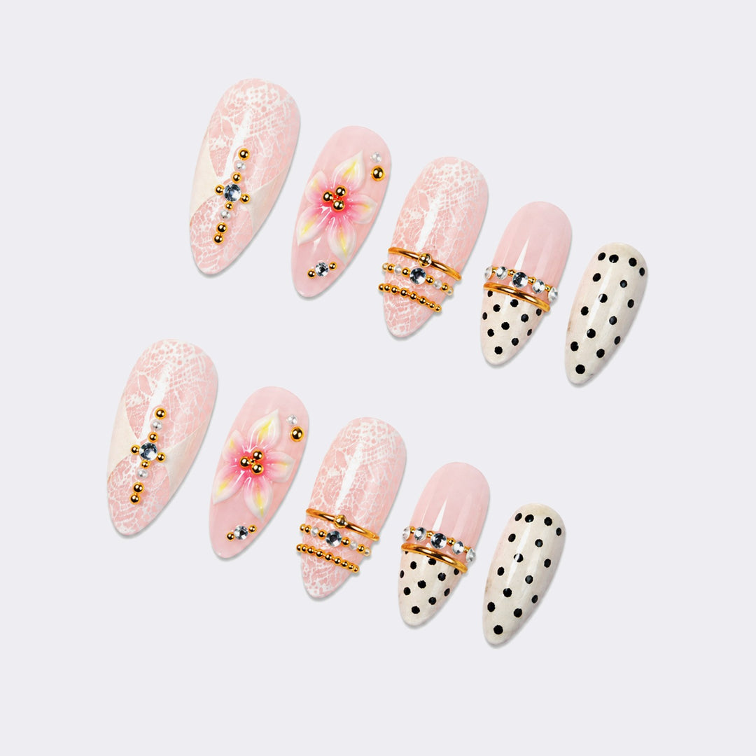 Artificial nail set with floral and glittering accents Stornfield