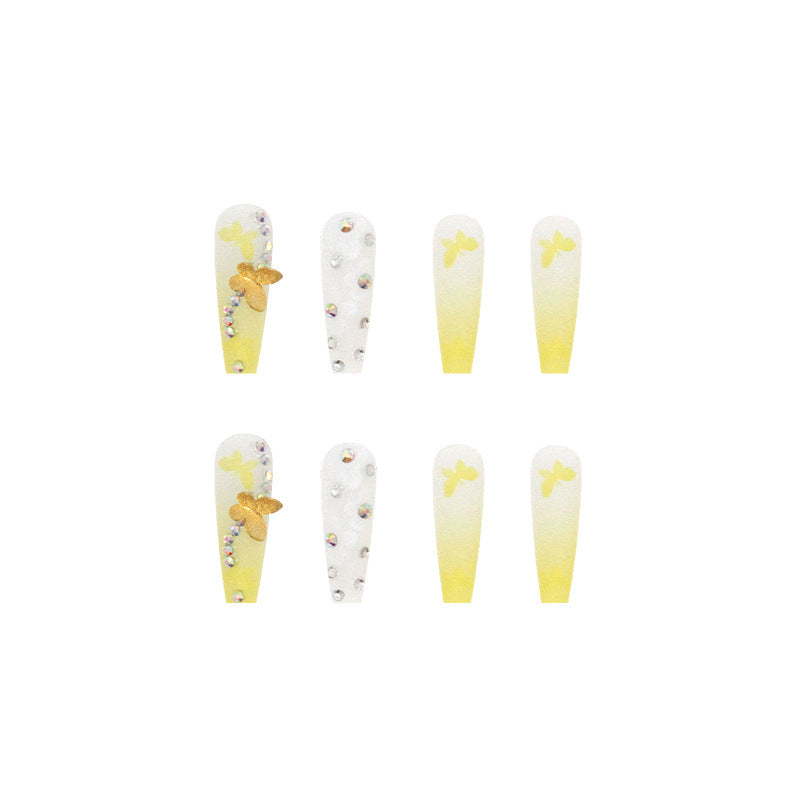 Artificial nail extensions with floral accents and rhinestones Stornfield