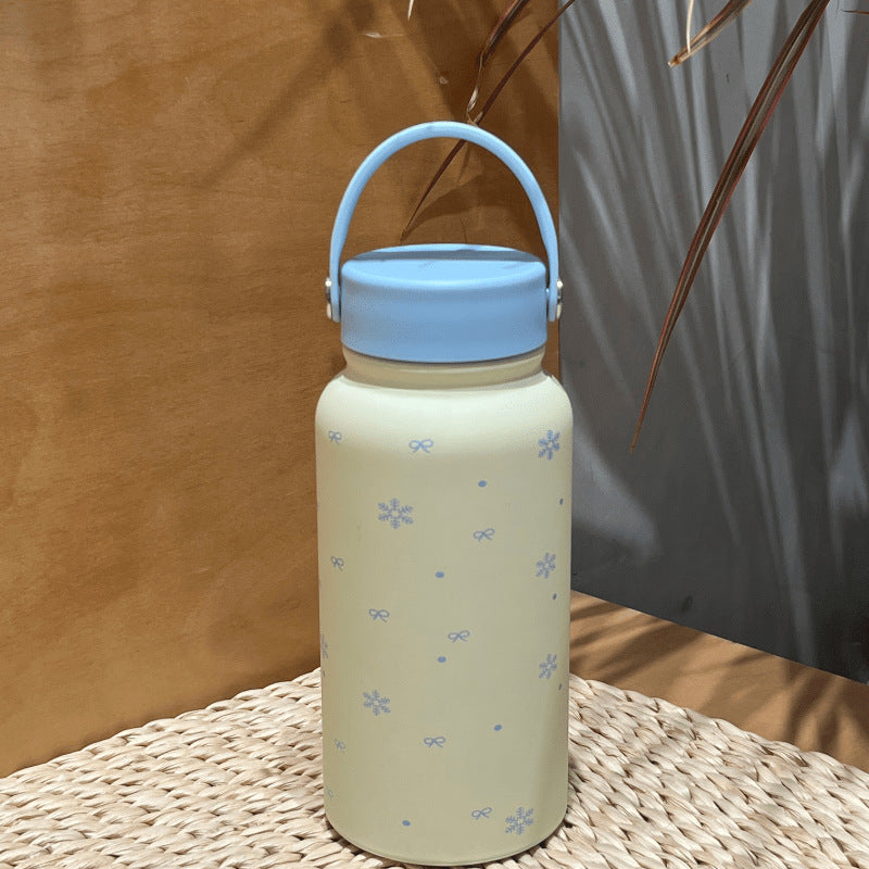 Women's insulated drinking bottle with practical carrying handle and cheerful design Stornfield
